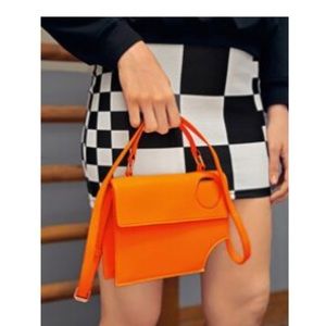 Asymmetrical satchel bag